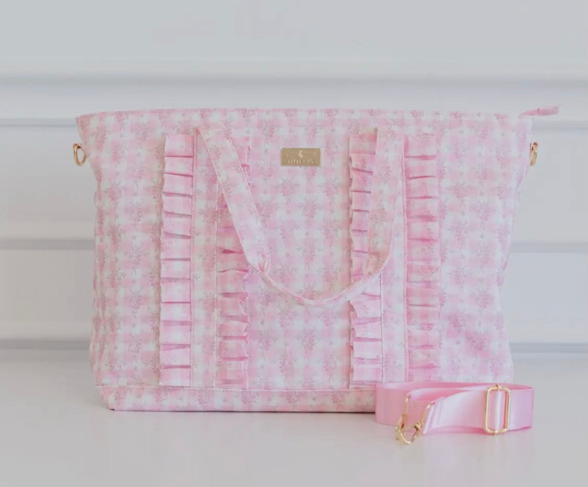 Pink floral ruffle carry on bag