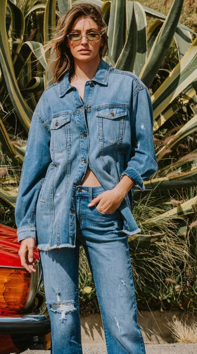 Distressed drop shoulder oversized denim button up jacket with fray hem