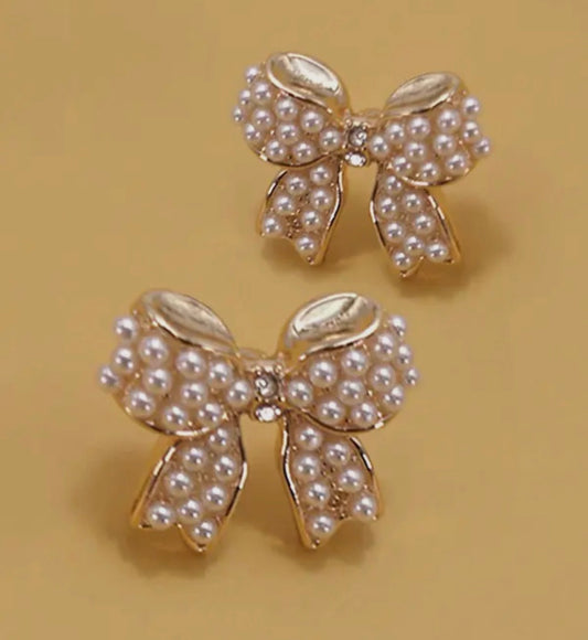 Gold bow studs with jewel & pearl detail