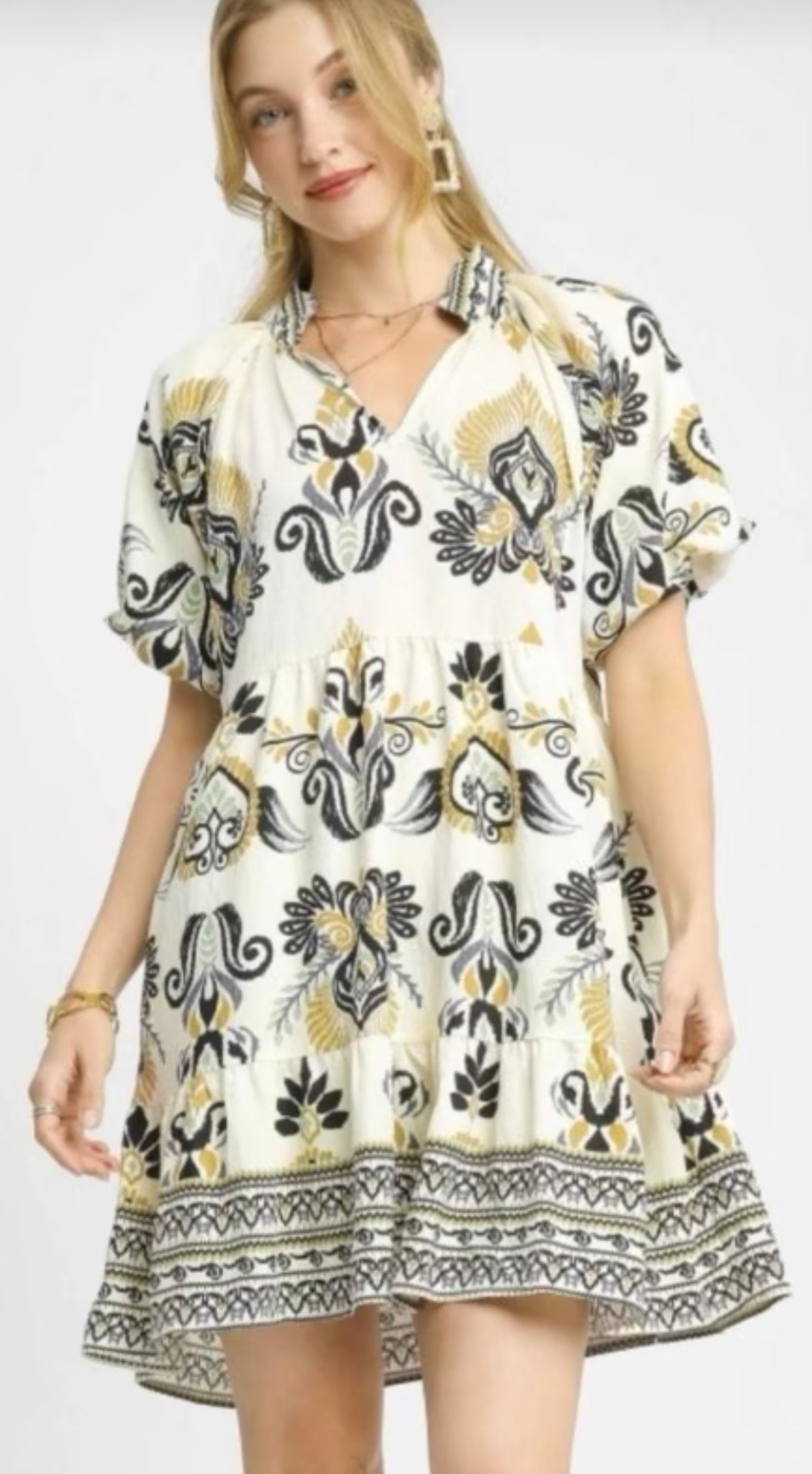 White mid length dress with black gold and grey design