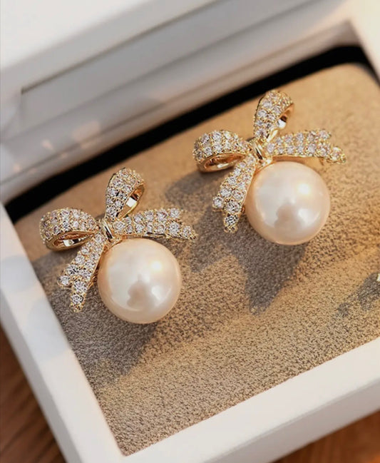 Single pearl bow earrings